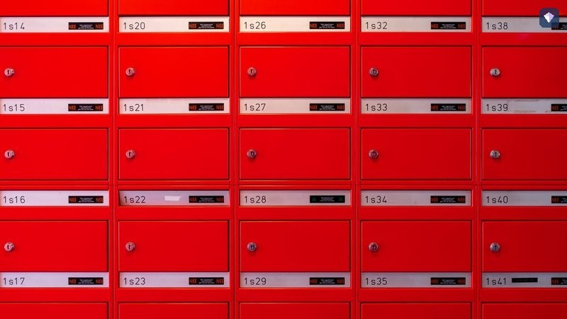 A wall of red post boxes arranged in a grid