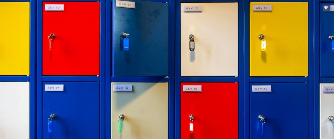 Lockers in several colours with the keys left in their doors