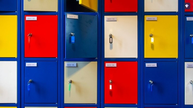 Lockers in several colours with the keys left in their doors