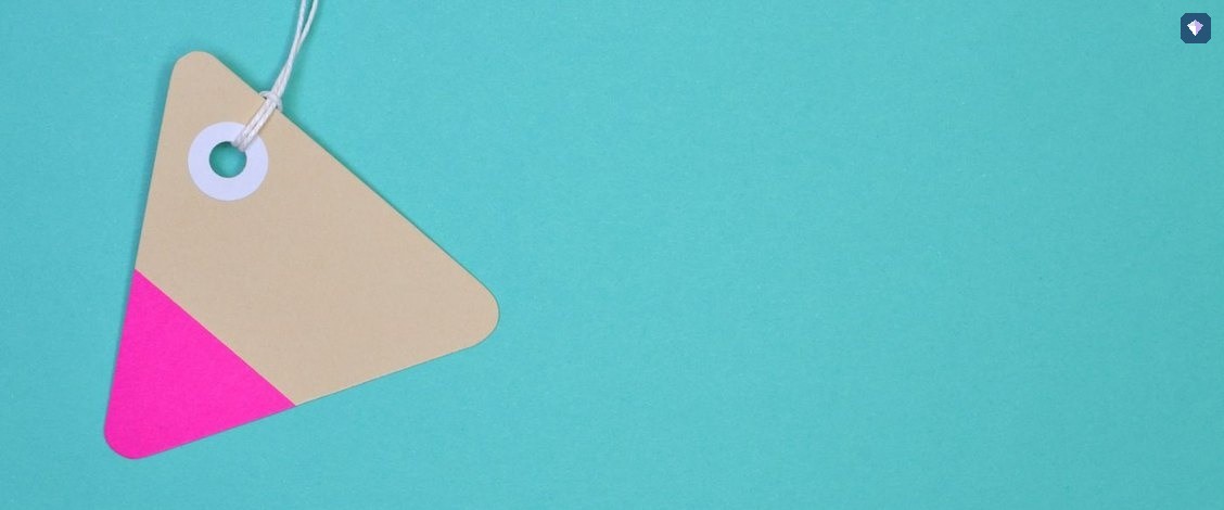 A blank paper tag on a teal background