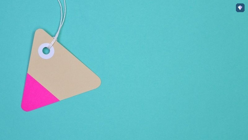 A blank paper tag on a teal background
