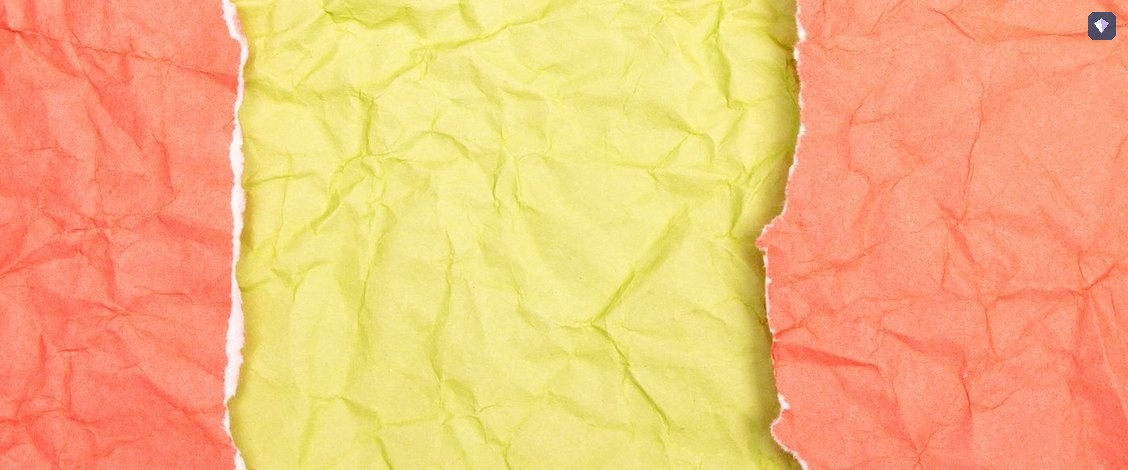 Red and yellow paper torn across the middle